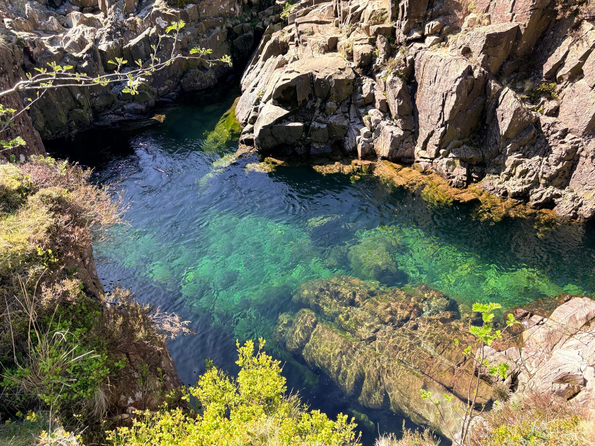 Black Moss Pot — a hidden turquoise pool surrounded by mossy rocks in the Lake District
