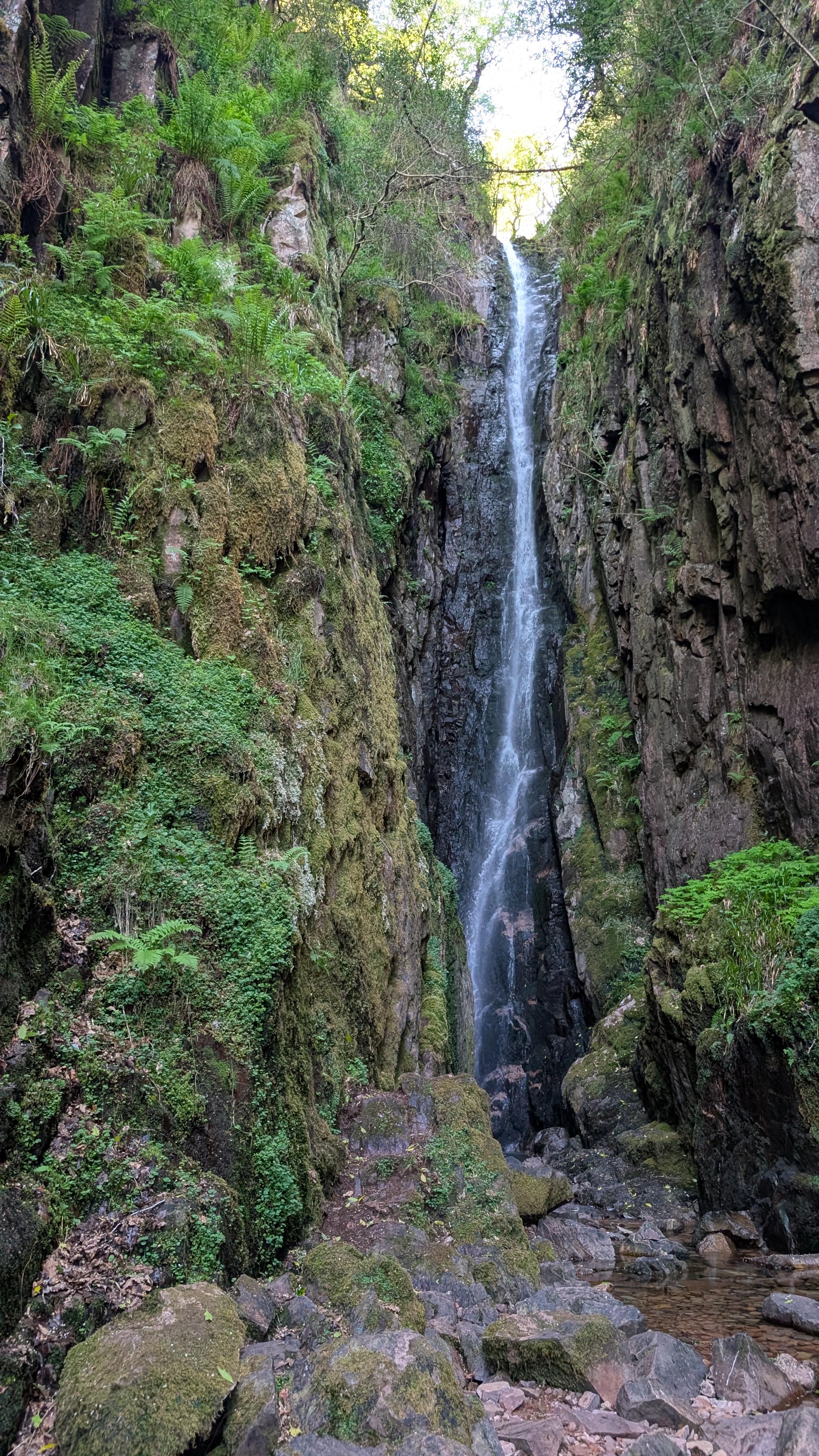 Scale Force waterfall cascading through a rocky gorge in Cumbria